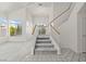A bright staircase is accented by the natural lighting throughout the home at 1540 Singing Bird Ln, North Las Vegas, NV 89031
