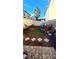 Relaxing backyard with artificial turf, a hammock, and a grill for outdoor enjoyment at 2131 Pillar Pointe St, Las Vegas, NV 89115