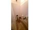 Close-up of bathtub with shower head and built in shelving at 2131 Pillar Pointe St, Las Vegas, NV 89115