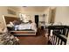 Bedroom with a king bed and natural light; closet and baby area at 2131 Pillar Pointe St, Las Vegas, NV 89115