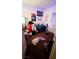 A cozy bedroom featuring natural light, posters, and a bed at 2131 Pillar Pointe St, Las Vegas, NV 89115