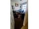Bedroom with a bed, desk, and window with blue striped curtains at 2131 Pillar Pointe St, Las Vegas, NV 89115