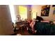 Bedroom with a vanity and lighted mirror, twin bed, and window at 2131 Pillar Pointe St, Las Vegas, NV 89115