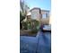 Charming two-story home with desert landscaping, a driveway, and an attached garage at 2131 Pillar Pointe St, Las Vegas, NV 89115