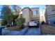 Charming two-story home with desert landscaping, a driveway, and an attached garage at 2131 Pillar Pointe St, Las Vegas, NV 89115