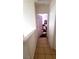 Hallway leading to bedroom with tile floor and white walls at 2131 Pillar Pointe St, Las Vegas, NV 89115