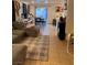 Living space with sectional sofa, dining area, and access to the outdoors at 2131 Pillar Pointe St, Las Vegas, NV 89115