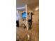 Open concept living room with tile floors and a entertainment center at 2131 Pillar Pointe St, Las Vegas, NV 89115