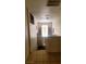 A bright stairway with tile landing, leading down to carpeted stairs at 2131 Pillar Pointe St, Las Vegas, NV 89115