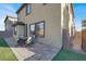 Charming patio area with outdoor seating, perfect for enjoying the backyard with artificial turf and privacy wall at 232 Delighted Ave, North Las Vegas, NV 89031