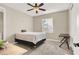 Cozy bedroom features a comfortable bed, a window offering natural light, and neutral décor, perfect for relaxation at 232 Delighted Ave, North Las Vegas, NV 89031