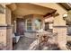 Charming front porch featuring an outdoor seating area, creating an inviting and welcoming entrance to the home at 232 Delighted Ave, North Las Vegas, NV 89031