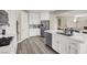 Bright and airy kitchen with stainless steel appliances, a large island, and hardwood floors at 232 Delighted Ave, North Las Vegas, NV 89031