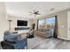 Relaxing living room with a ceiling fan, modern decor, and comfortable seating at 232 Delighted Ave, North Las Vegas, NV 89031
