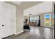 View from hallway to a living area featuring modern furnishings and natural light at 232 Delighted Ave, North Las Vegas, NV 89031