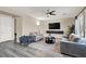 Comfortable living room featuring modern furnishings, a ceiling fan, and TV at 232 Delighted Ave, North Las Vegas, NV 89031