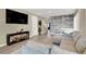 Stylish living room with hardwood floors, a modern accent wall, and comfortable seating at 232 Delighted Ave, North Las Vegas, NV 89031