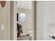 A hallway view of the powder room with toilet and decor at 232 Delighted Ave, North Las Vegas, NV 89031