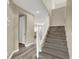 Staircase leading to the upper level, featuring neutral carpet and white railing at 232 Delighted Ave, North Las Vegas, NV 89031