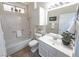Bathroom showcasing white cabinets, tile flooring, and shower-tub combo at 2501 Maddington Dr, Las Vegas, NV 89134