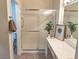 Bathroom featuring glass shower, tile floor, and white vanity at 2501 Maddington Dr, Las Vegas, NV 89134