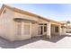 Backyard view of the home with awning covered windows and patio at 2501 Maddington Dr, Las Vegas, NV 89134