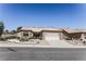 Charming single-story home featuring a two-car garage and xeriscaped front yard at 2501 Maddington Dr, Las Vegas, NV 89134