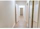 Hallway with several doors, tiled floors, and a mirrored closet at 2501 Maddington Dr, Las Vegas, NV 89134