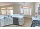 Kitchen with modern stainless appliances, breakfast bar, and open floor plan at 2501 Maddington Dr, Las Vegas, NV 89134