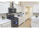 Well-equipped kitchen featuring white cabinets and stainless steel gas range at 2501 Maddington Dr, Las Vegas, NV 89134