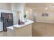 Modern kitchen featuring stainless steel appliances and open layout to the living area at 2501 Maddington Dr, Las Vegas, NV 89134