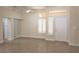 Bright living room with tile flooring, large mirror and a ceiling fan at 2501 Maddington Dr, Las Vegas, NV 89134