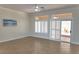 Inviting living room featuring tile flooring, plantation shutters, and natural light at 2501 Maddington Dr, Las Vegas, NV 89134