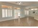 Open-concept room with tile flooring, plantation shutters, and slider to back yard at 2501 Maddington Dr, Las Vegas, NV 89134