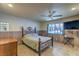 Comfortable bedroom with a decorative wrought iron bed frame, neutral decor, and a window at 2531 La Cara Ave, Las Vegas, NV 89121