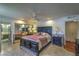 Bedroom with dark furniture, mirrored closet, and an ensuite bath at 2531 La Cara Ave, Las Vegas, NV 89121