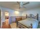 Comfortable bedroom with decorative metal bed frame and ceiling fan at 2531 La Cara Ave, Las Vegas, NV 89121
