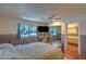 Cozy bedroom with a ceiling fan, large window, and ensuite bathroom access at 2531 La Cara Ave, Las Vegas, NV 89121