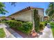 Exterior shot of a well-maintained home with desert landscaping, tile roof, and block wall at 2531 La Cara Ave, Las Vegas, NV 89121