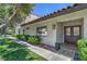 Inviting home entrance featuring a stone walkway, a tile roof, and mature landscaping at 2531 La Cara Ave, Las Vegas, NV 89121