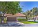 Charming single-story home with a two-car garage, tile roof, mature landscaping, and inviting curb appeal at 2531 La Cara Ave, Las Vegas, NV 89121