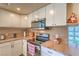 Well-lit kitchen featuring modern stainless steel appliances, wood countertops, and white cabinetry at 2531 La Cara Ave, Las Vegas, NV 89121