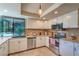Bright, updated kitchen with stainless steel appliances and a window with a view to the pool at 2531 La Cara Ave, Las Vegas, NV 89121