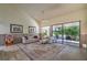 Comfortable living room with plush seating, a decorative rug, and sliding glass doors to outdoor space at 2531 La Cara Ave, Las Vegas, NV 89121