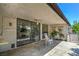 Covered patio features herringbone tile and access to the home through sliding glass doors at 2531 La Cara Ave, Las Vegas, NV 89121