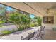 Relaxing patio with chairs, beautiful plantings, and a ceiling fan at 2531 La Cara Ave, Las Vegas, NV 89121