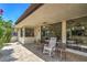 Outdoor patio space with plants, seating and view of the home at 2531 La Cara Ave, Las Vegas, NV 89121