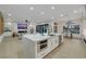 Bright kitchen with a large island, white cabinets and stainless steel appliances at 2621 Spalding Dr, Las Vegas, NV 89134