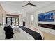 This bedroom has a seating area, fireplace, television, and doors to the backyard at 2621 Spalding Dr, Las Vegas, NV 89134