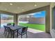Covered patio area with outdoor dining and view of the yard at 3005 Merlesco Ave, Henderson, NV 89044
